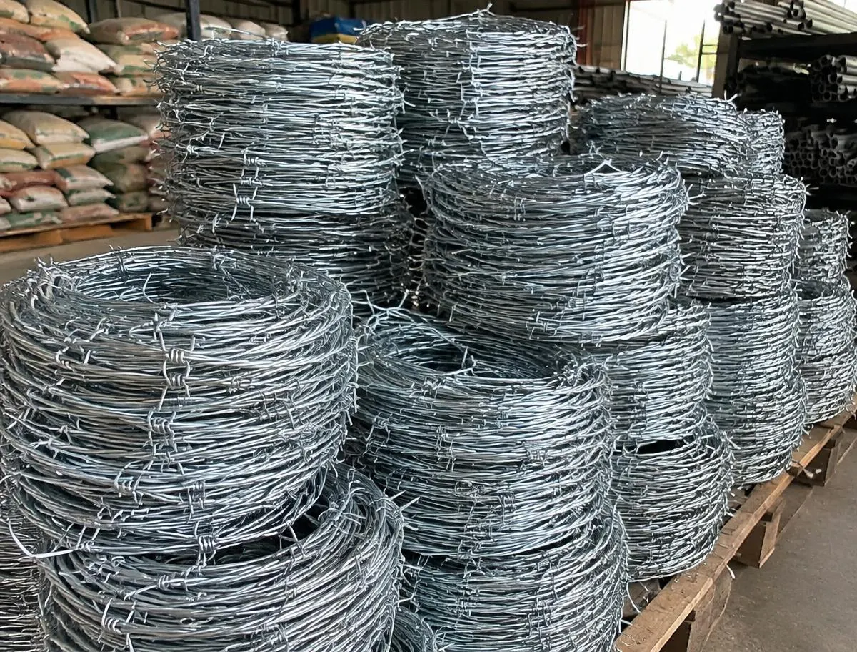 GI Barbed Wire (Kanta Taar) — sorted stock in a timber yard