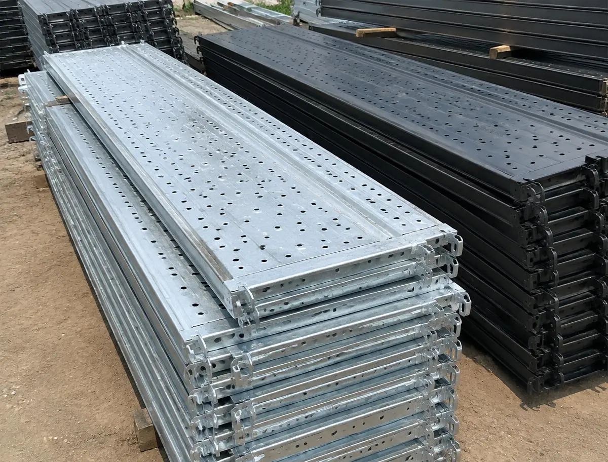 Steel Walkway Planks (Khapeda / Jali) — sorted stock in a timber yard